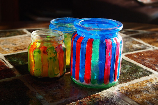 Screw-top jars, painted with colorful stripes