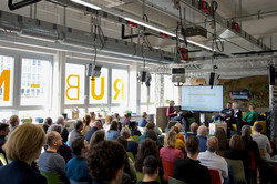 Photo: A photo of the audience in the makerspace at Ruhr University Bochum.