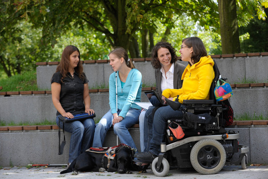 Students with handicap Students with handicap are sitting together on campus.
