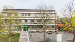International Office Student affairs office with trees in front of it.