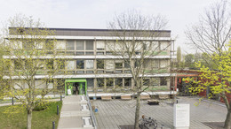 Student affairs office with trees in front of it.