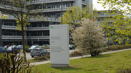 The building Emil-Figge-Straße 50 with a signpost in the foreground.