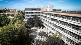 17: Social Sciences A long building surrounded by trees